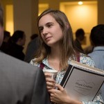 A young woman listens intently